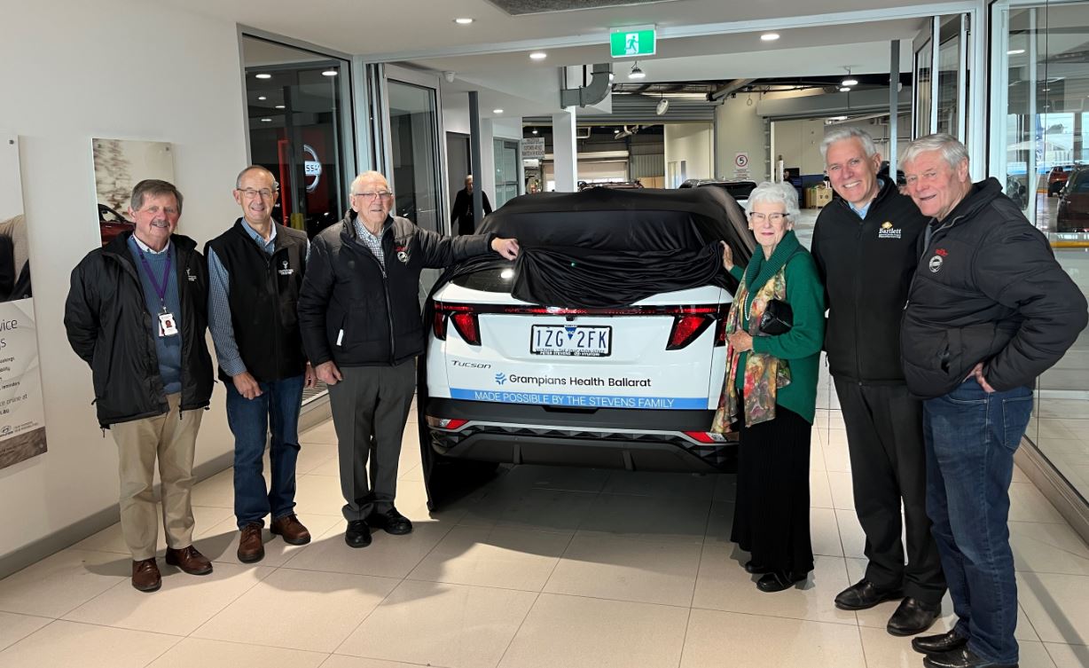 Pictured L-R; Members of the Grampians Health Volunteer Driver team, Rob Godfrey and Howard Costello celebrate the unveiling of a new patient transport vehicle with Peter Stevens, Helen Stevens, Nigel Stevens and Male Bag Foundation Ambassador David Parkin.
