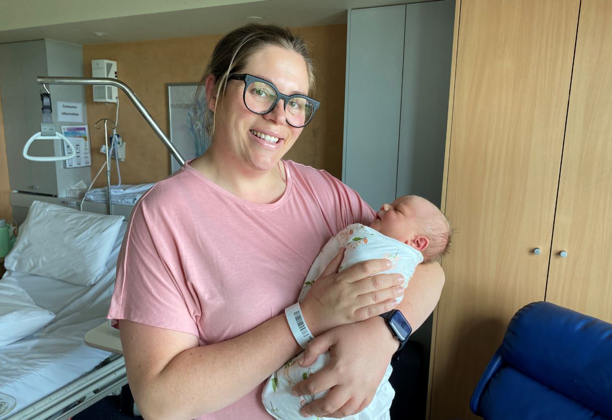 New mum Kate Anderson, who underwent a maternal assisted caesarean section, with her baby Oliver.