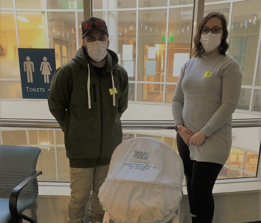 Taylor and Kayleigh Raine pictured with donated Cuddle Cot