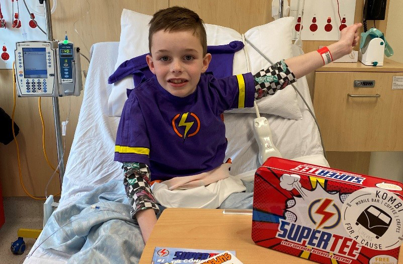 Paediatric patient Lucas zoning his superpower after being gifted a Supertee from BHS staff
