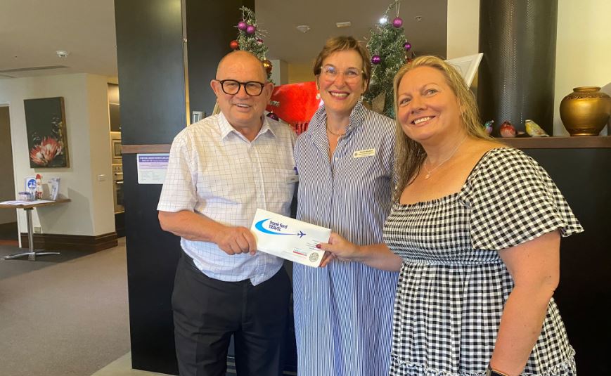 Raffle winner John Bourke is handed his French countryside travel prize by Grampians Health Head of Fundraising, Sarah Masters and Manager of the Wellness Centre Simone Noelker