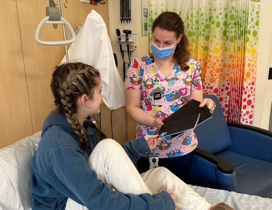 BHS patient receiving The Resilience Project Diary from Nurse Tahlia on Cotton On Foundation Children’s Ward