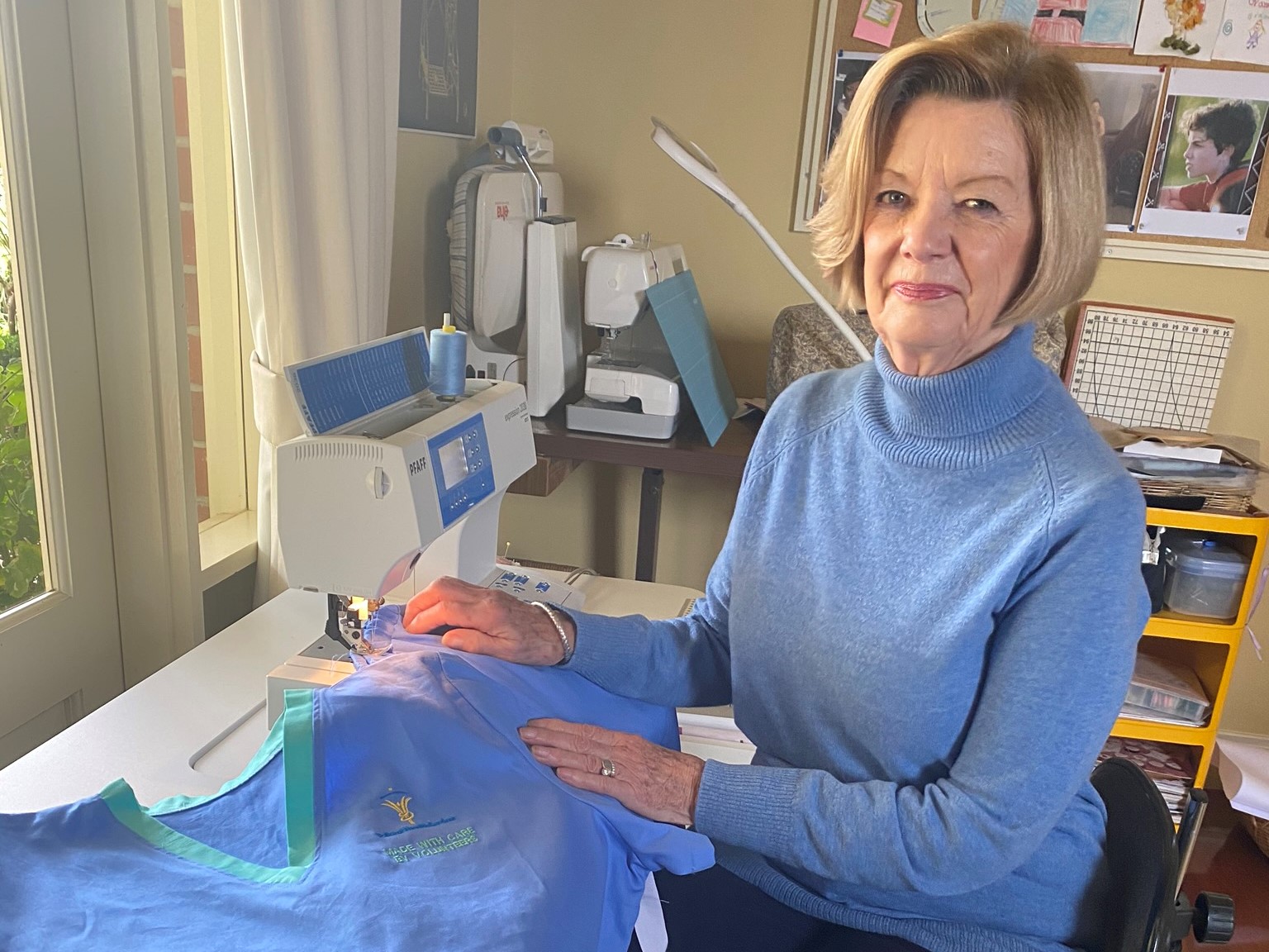 Volunteer Marlene sews Scrubs for Staff